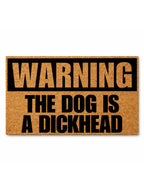 Doormat with humorous text 'WARNING: THE DOG IS A DICKHEAD' on a white background [VARIANT: DOG / DICKHEAD]