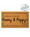 Doormat with text 'THERE'S NO PLACE LIKE Nanny & Poppy's HOUSE' on a white background