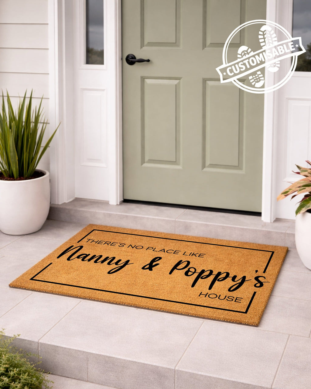 Doormat with text 'There's no place like Nanny & Poppy's House' in front of a door.
