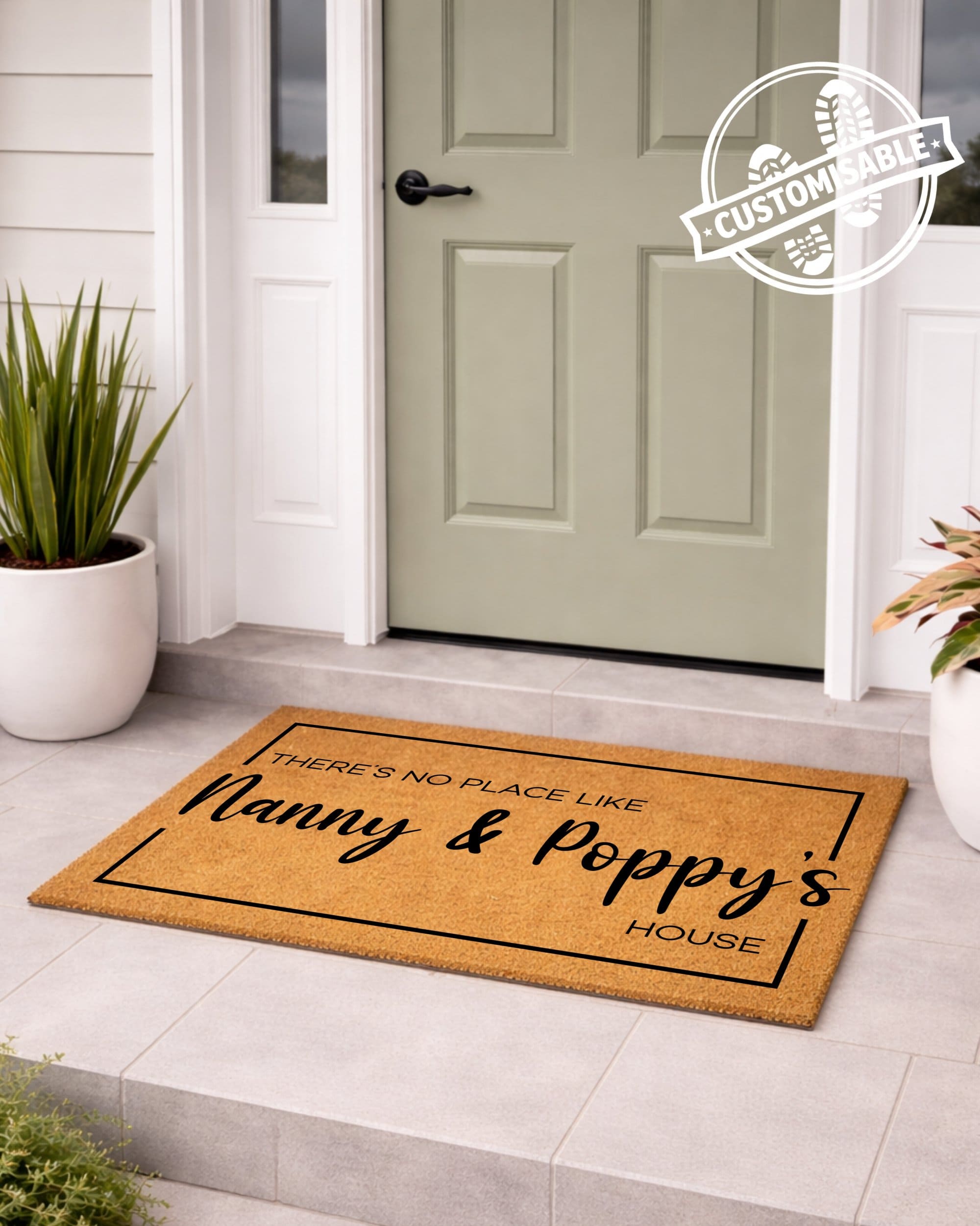 Doormat with text 'There's no place like Nanny & Poppy's House' in front of a door.