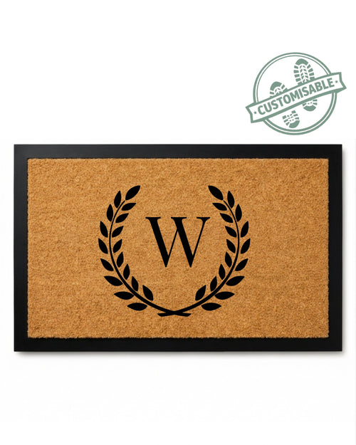 Doormat with monogram 'W' design on a white background [variant: single-initial-border]