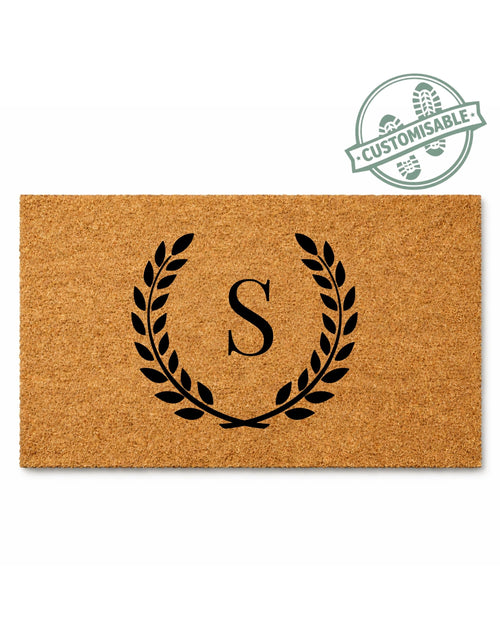 Doormat with monogram design and customizable badge on a white background [variant: single-initial-no-border]