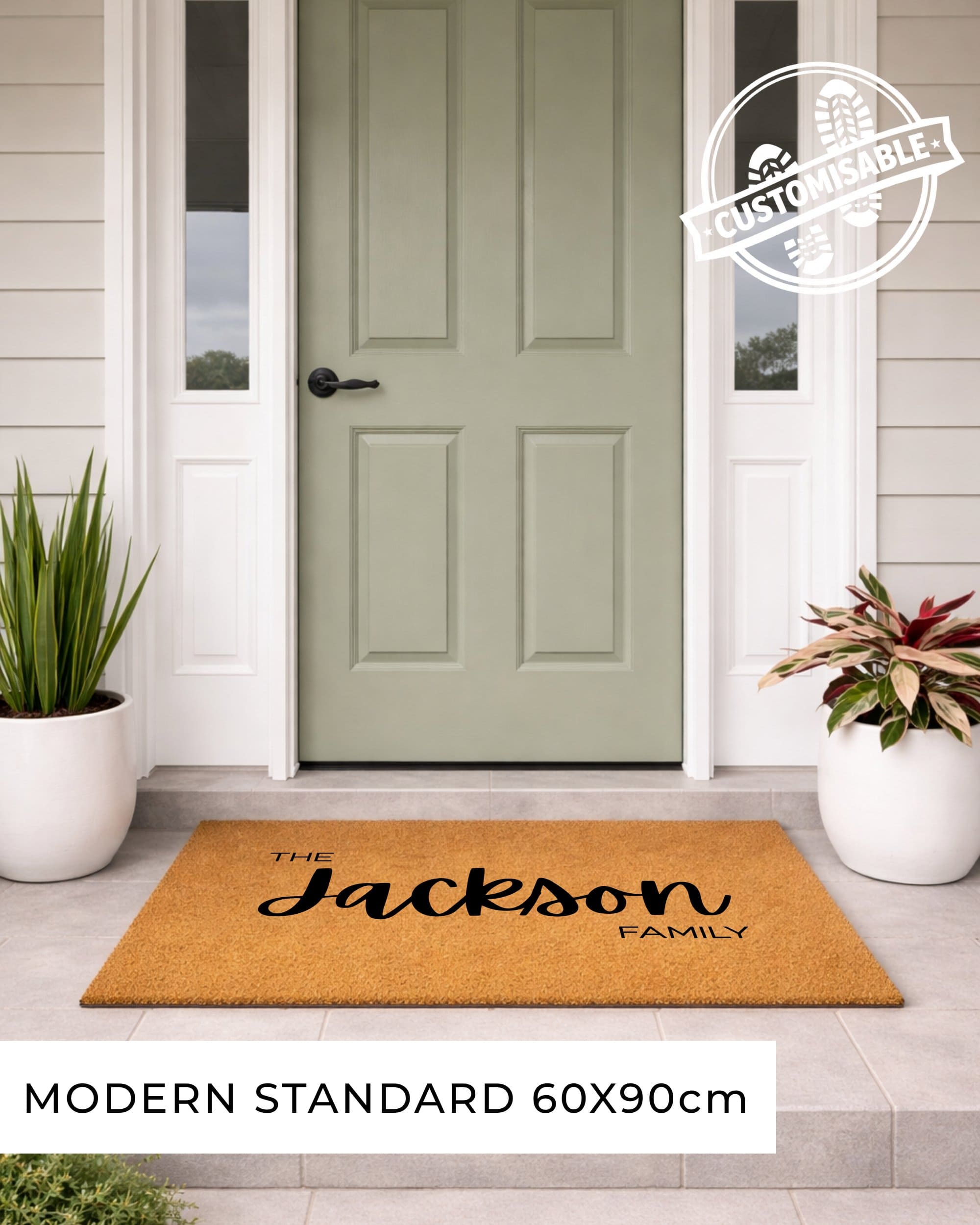 Doormat with 'welcome THE JOHNSONs' text in front of a green door on a house exterior. [VARIANT: STANDARD-NO-EST]