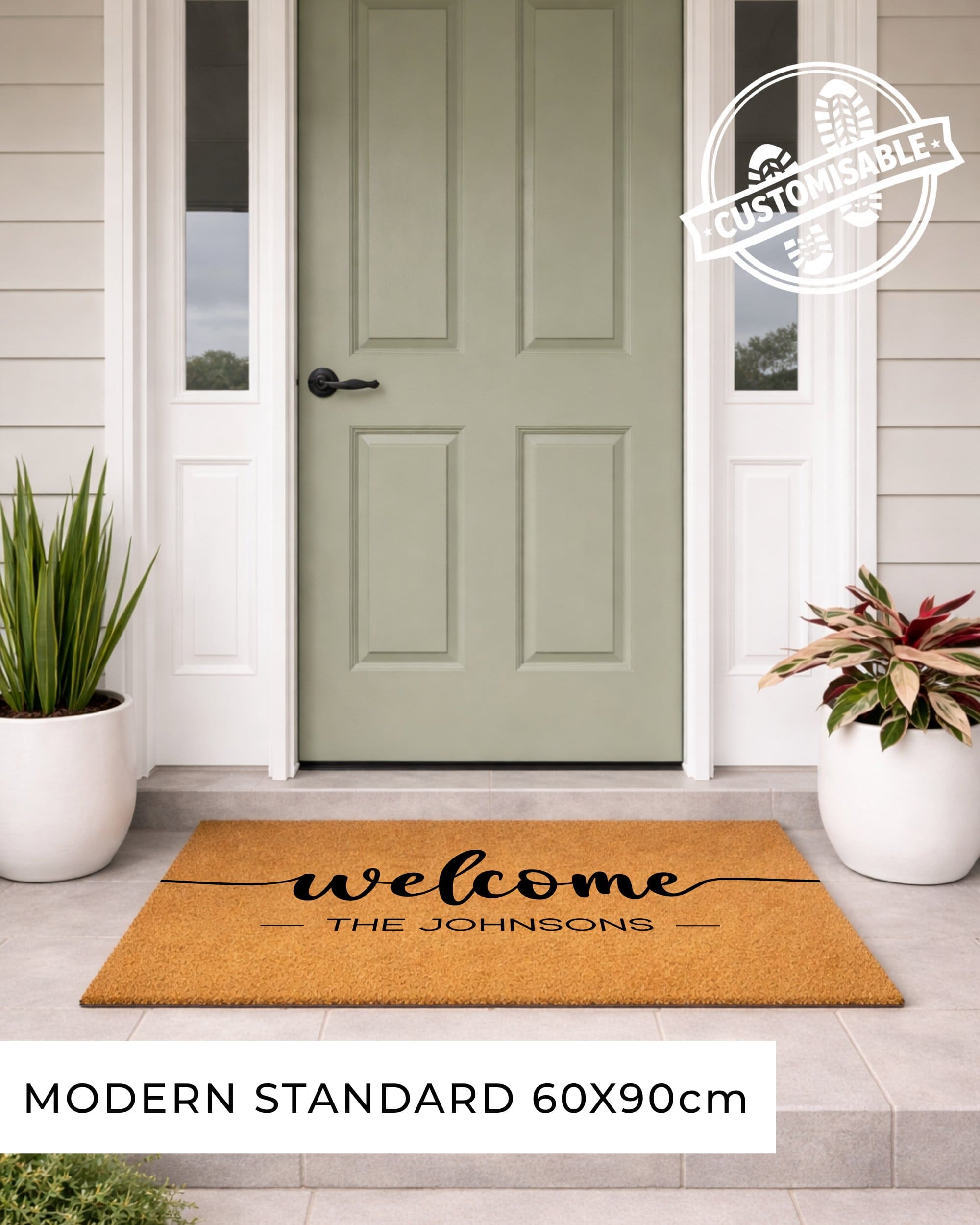 Doormat with 'welcome THE JOHNSONs' text in front of a green door on a house exterior. [VARIANT: STANDARD]
