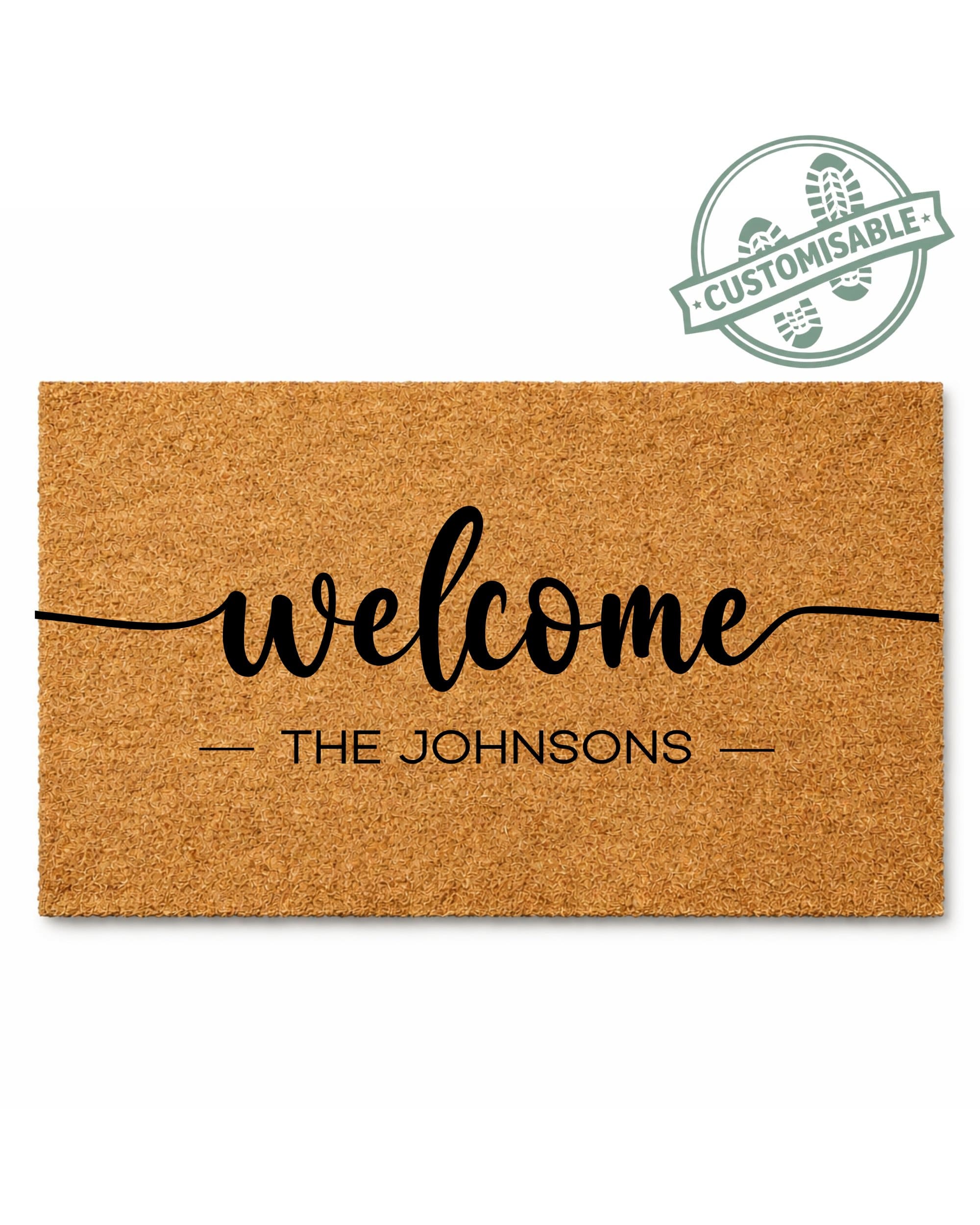Doormat with 'welcome THE JOHNSONs' text on a white background [VARIANT: STANDARD]