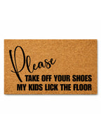 Doormat with humorous text 'Please take off your shoes my kids lick the floor' on a white background
