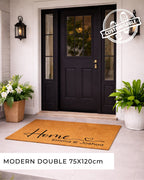 Front door with a doormat and plants, featuring a customizable logo.